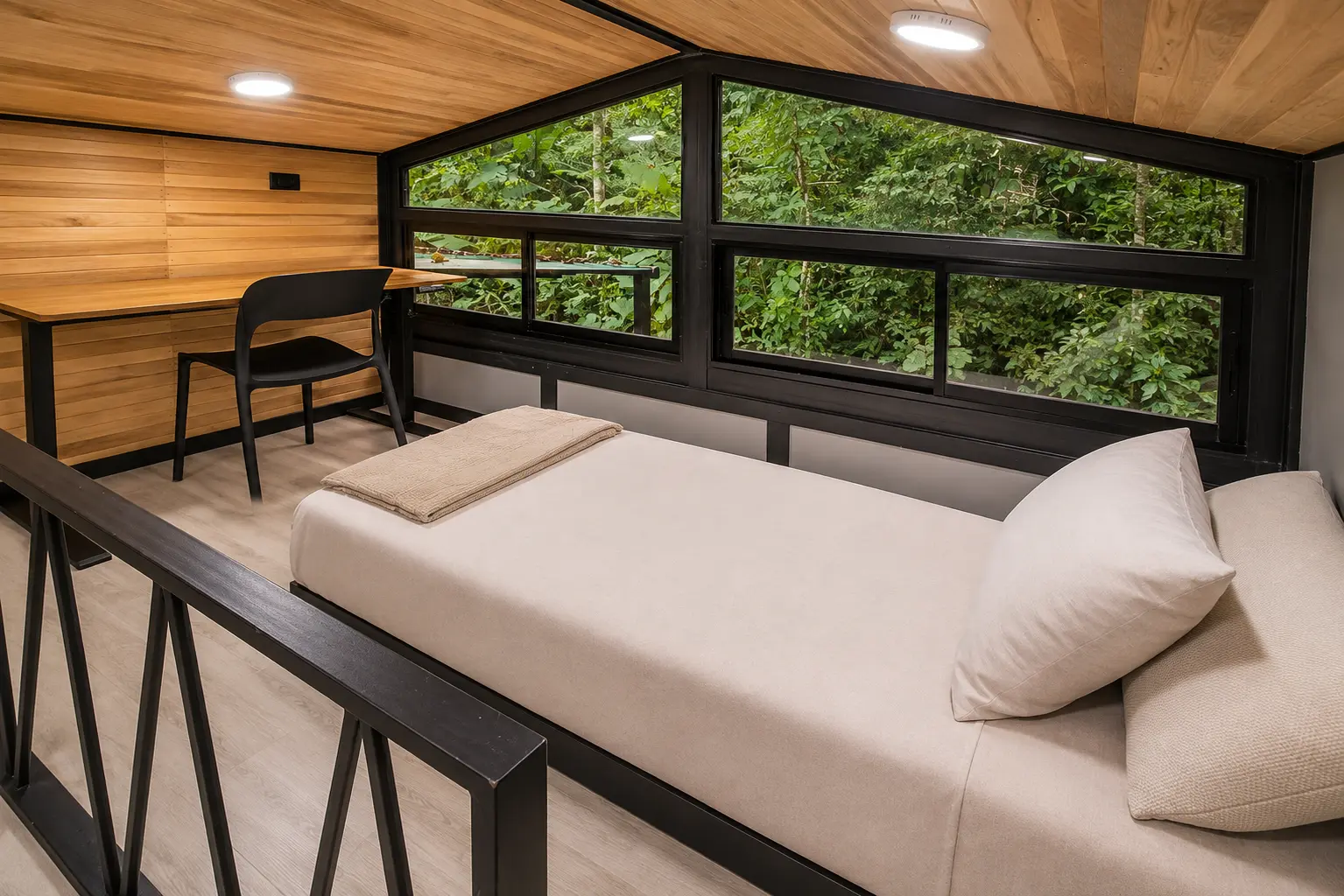Loft single bed and desk workspace in The Palm Jungalow tiny home rental