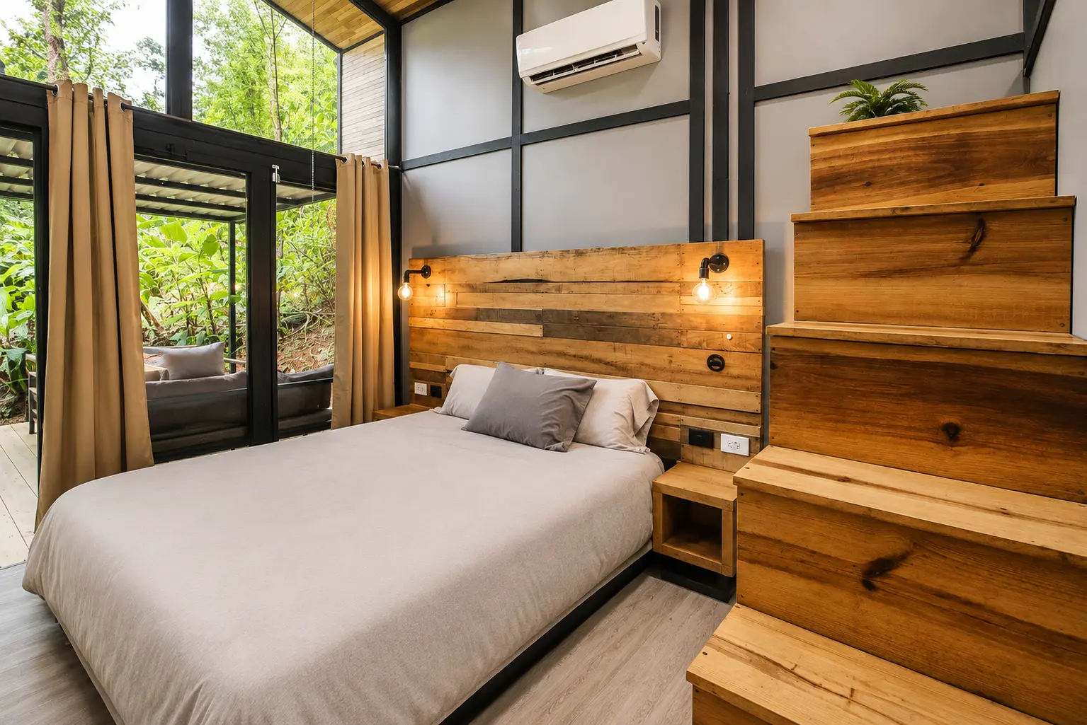 Palm Jungalow queen bed beside the loft stairs